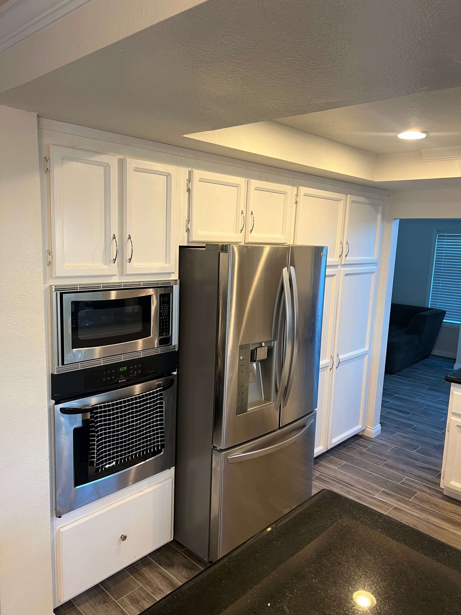 pantry addition next to stainless steel refrigerator La Mesa