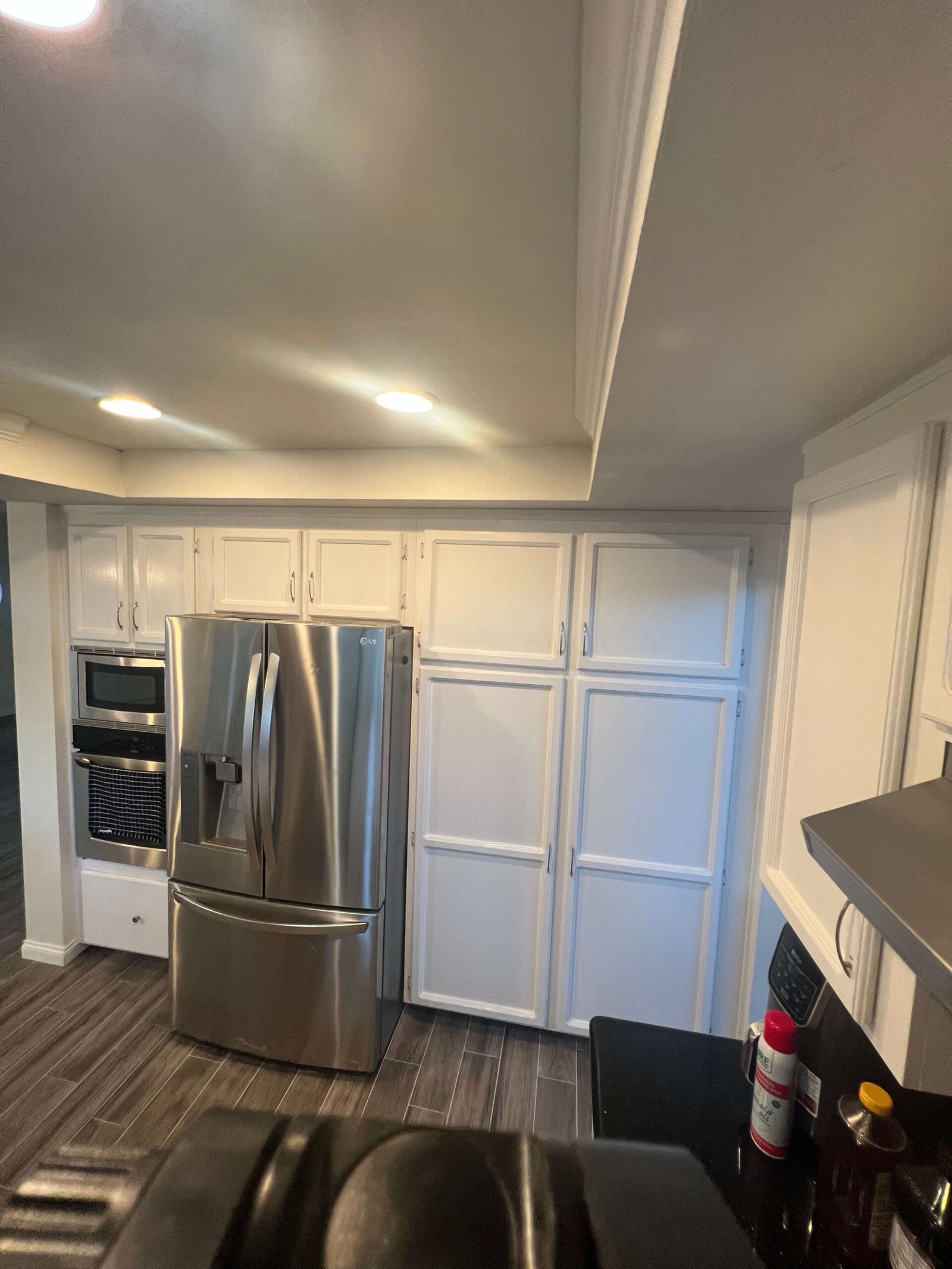 pantry addition next to stainless steel refrigerator La Mesa