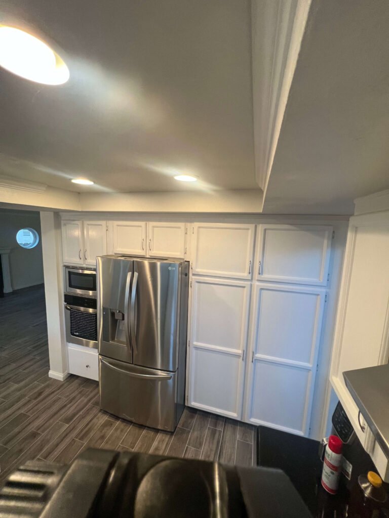 pantry addition next to stainless steel refrigerator La Mesa