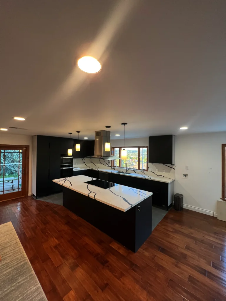 large kitchen island with waterfall quartz countertop Escondido