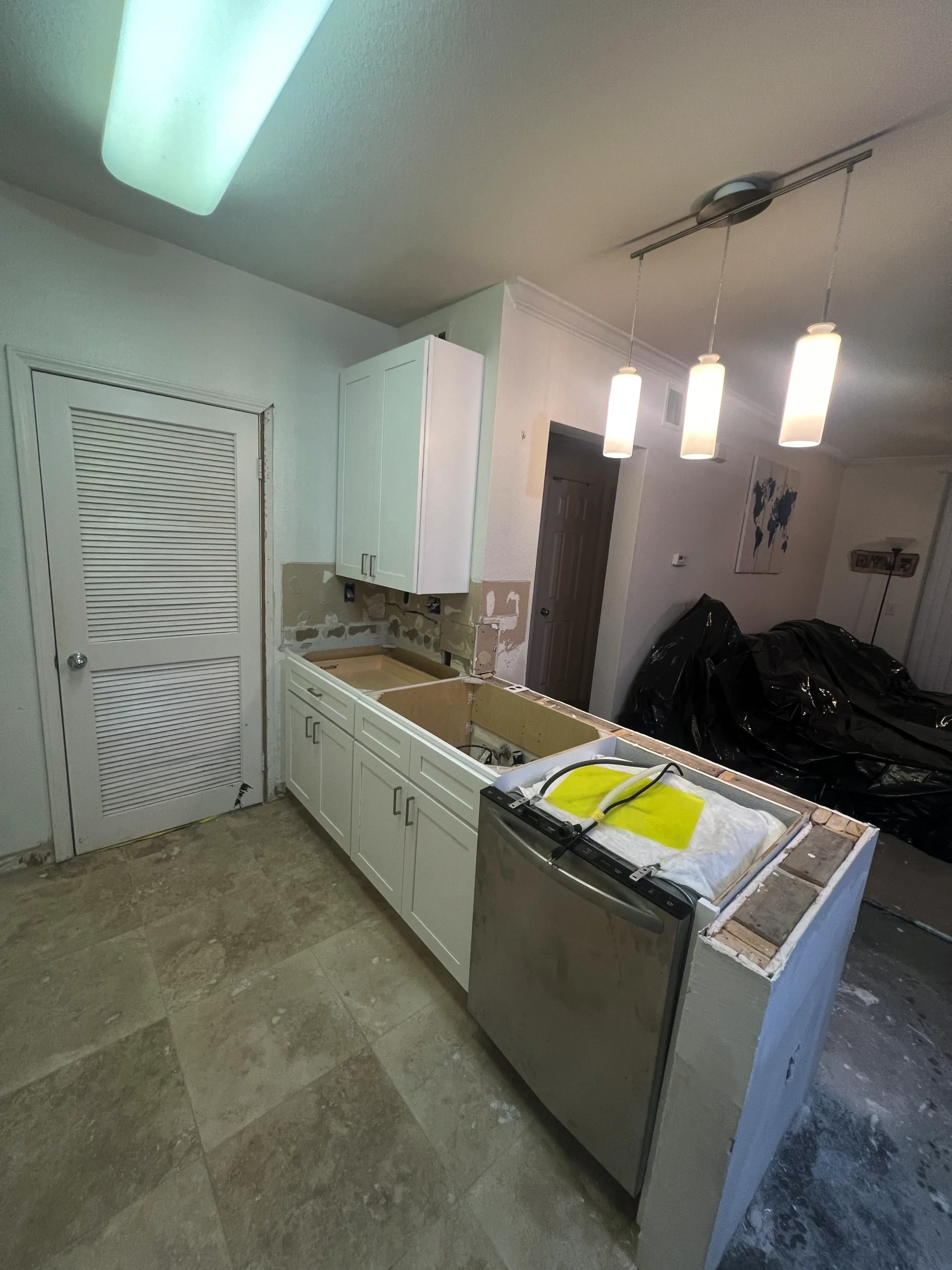 installing new kitchen peninsula for Ali's project in Del Mar