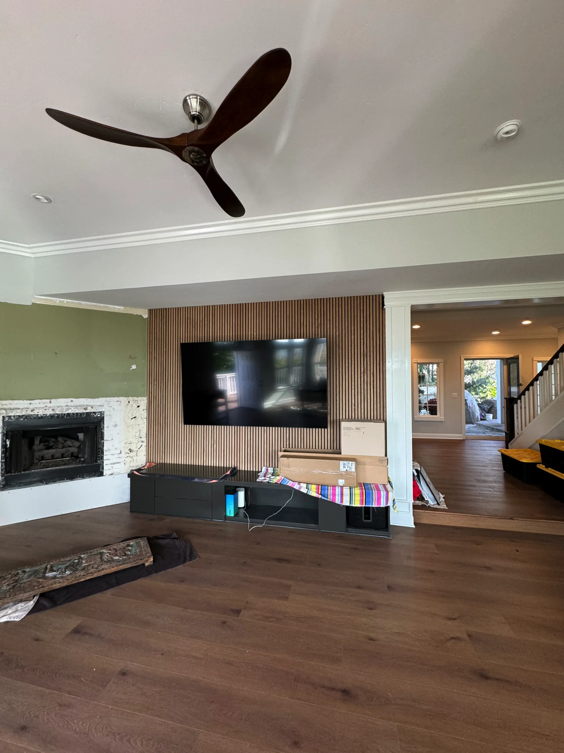 modern white oak slat wall with a floating media console