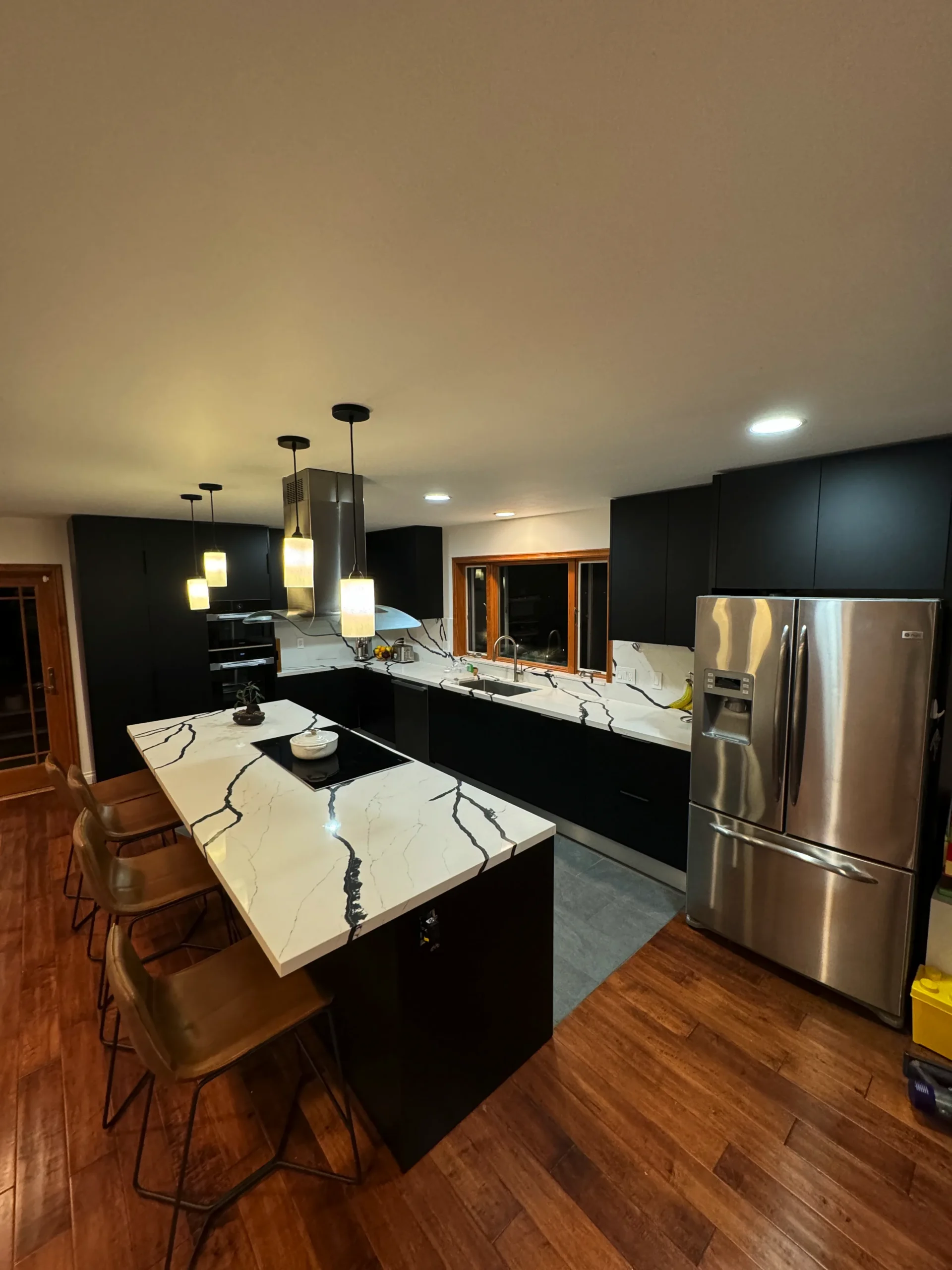 large kitchen island with waterfall quartz countertop Escondido