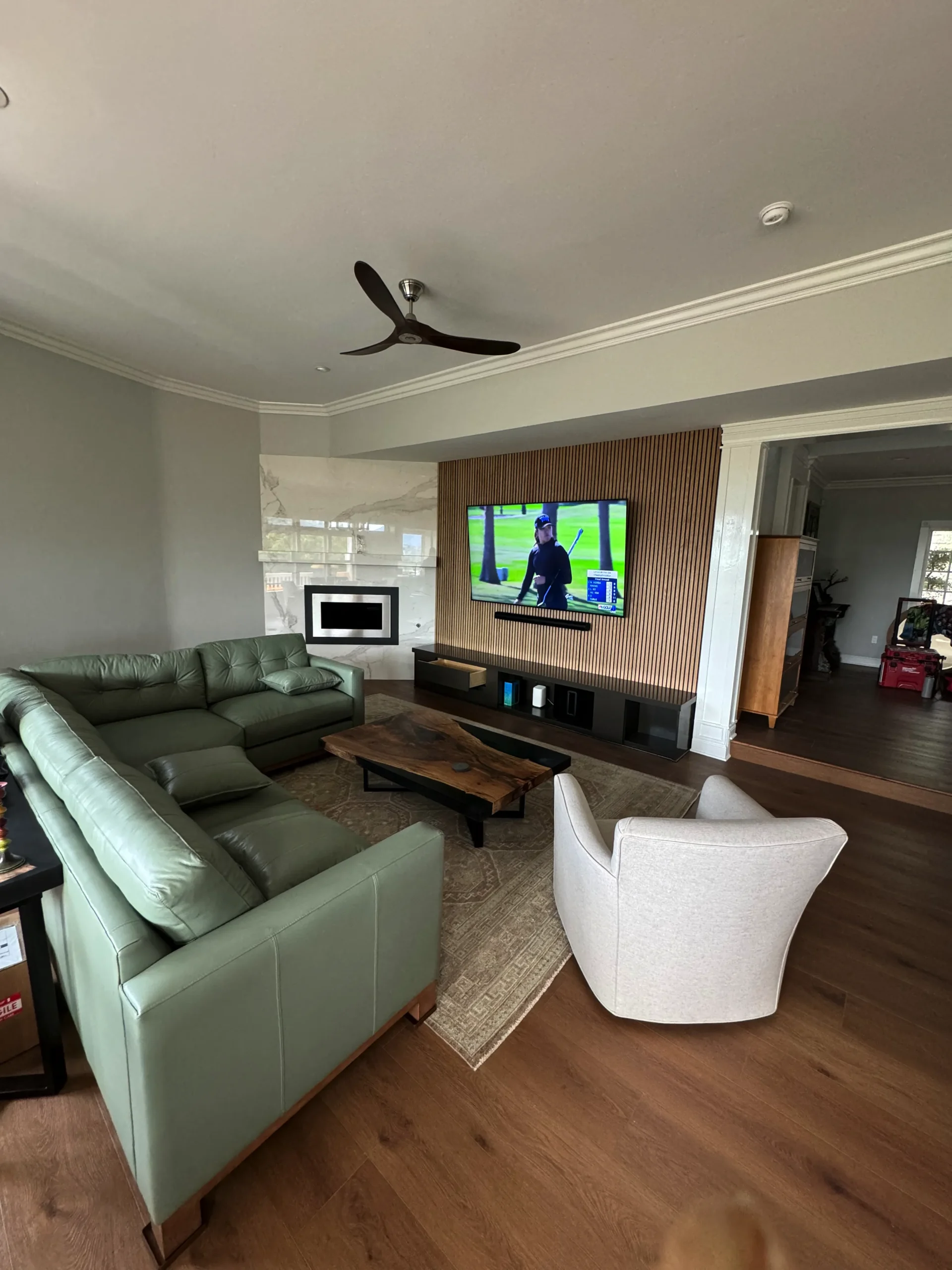 modern white oak slat wall with a floating media console