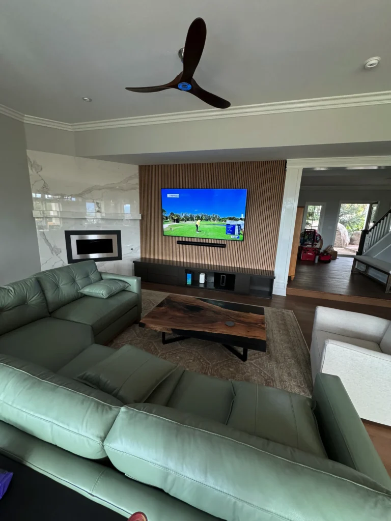 modern white oak slat wall with a floating media console