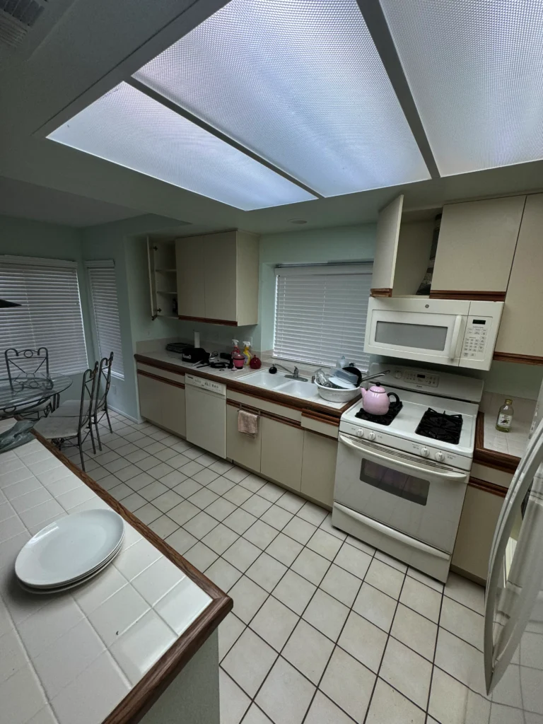 refacing dated 80s style cabinets to a modern white shaker look