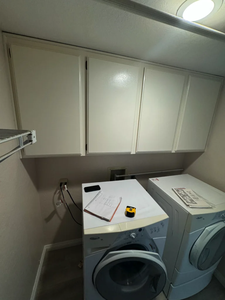 Encinitas laundry room with a deep utility sink and a floating wood shelf