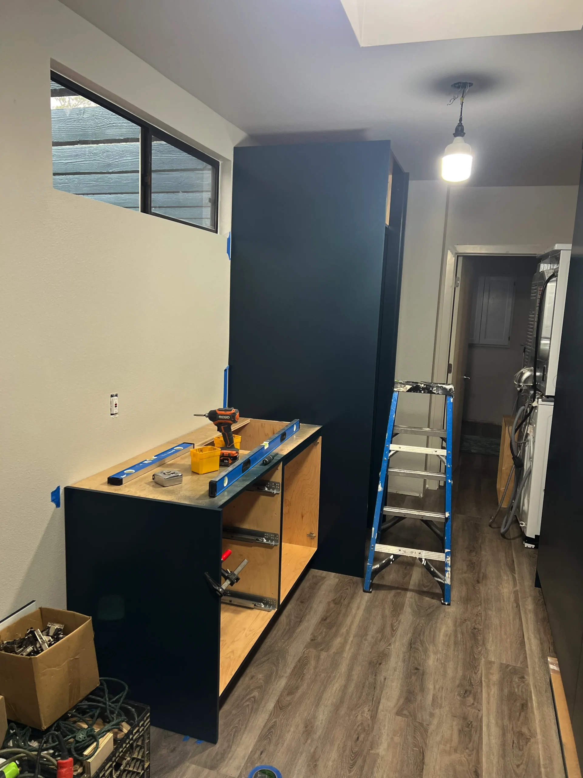 deep blue custom cabinets with large ring pull hardware