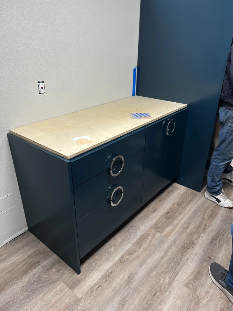 custom laundry room cabinets San Marcos with hidden washer dryer