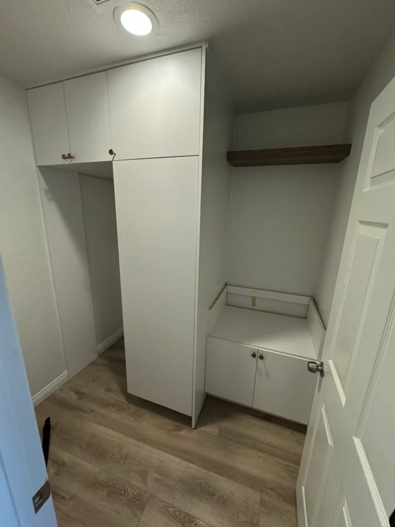 white flat panel cabinets designed for a stackable washer and dryer