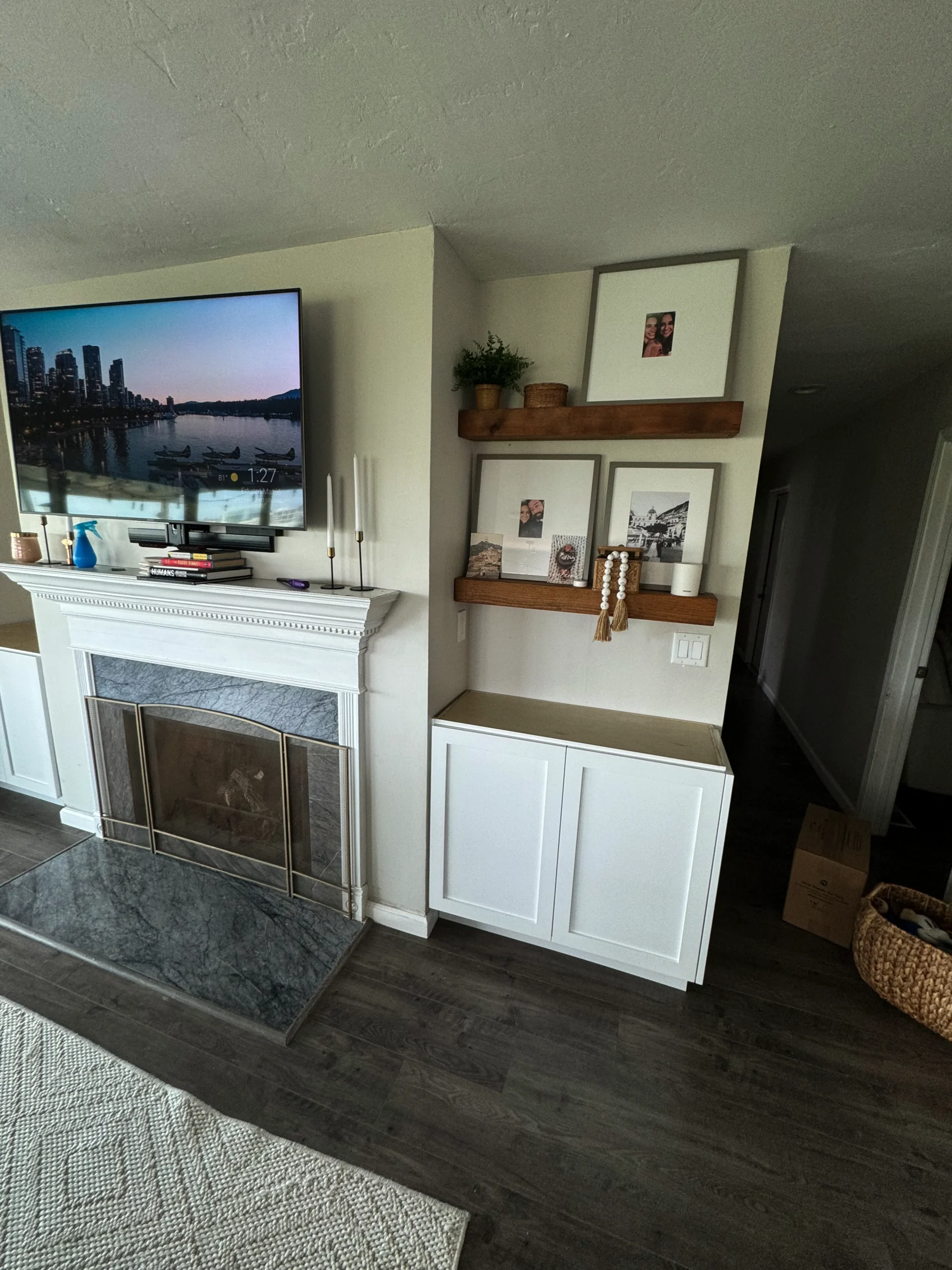 living room with custom storage and rustic white oak shelves