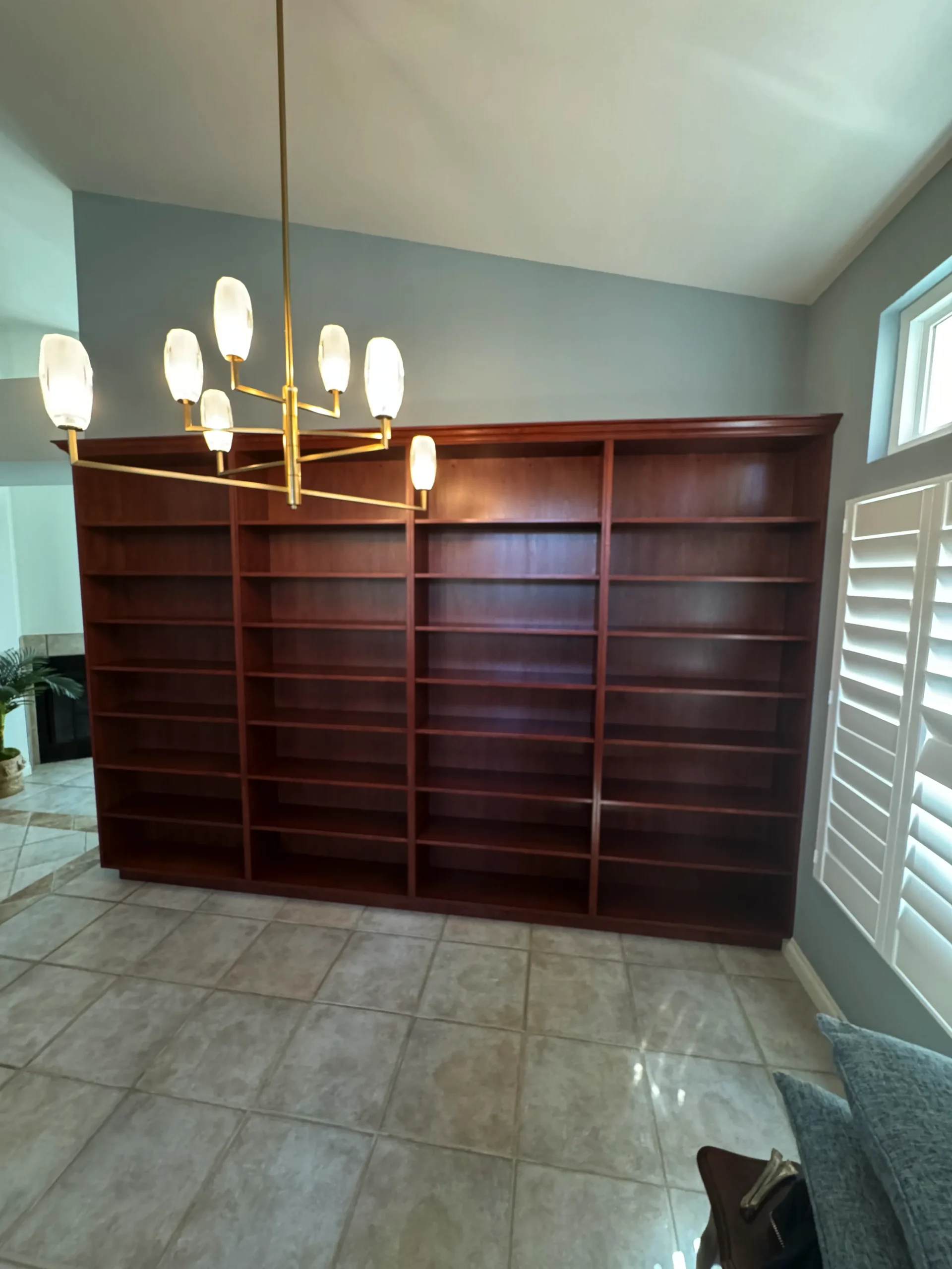 floor-to-ceiling cherry wood built-in bookcase for a home library