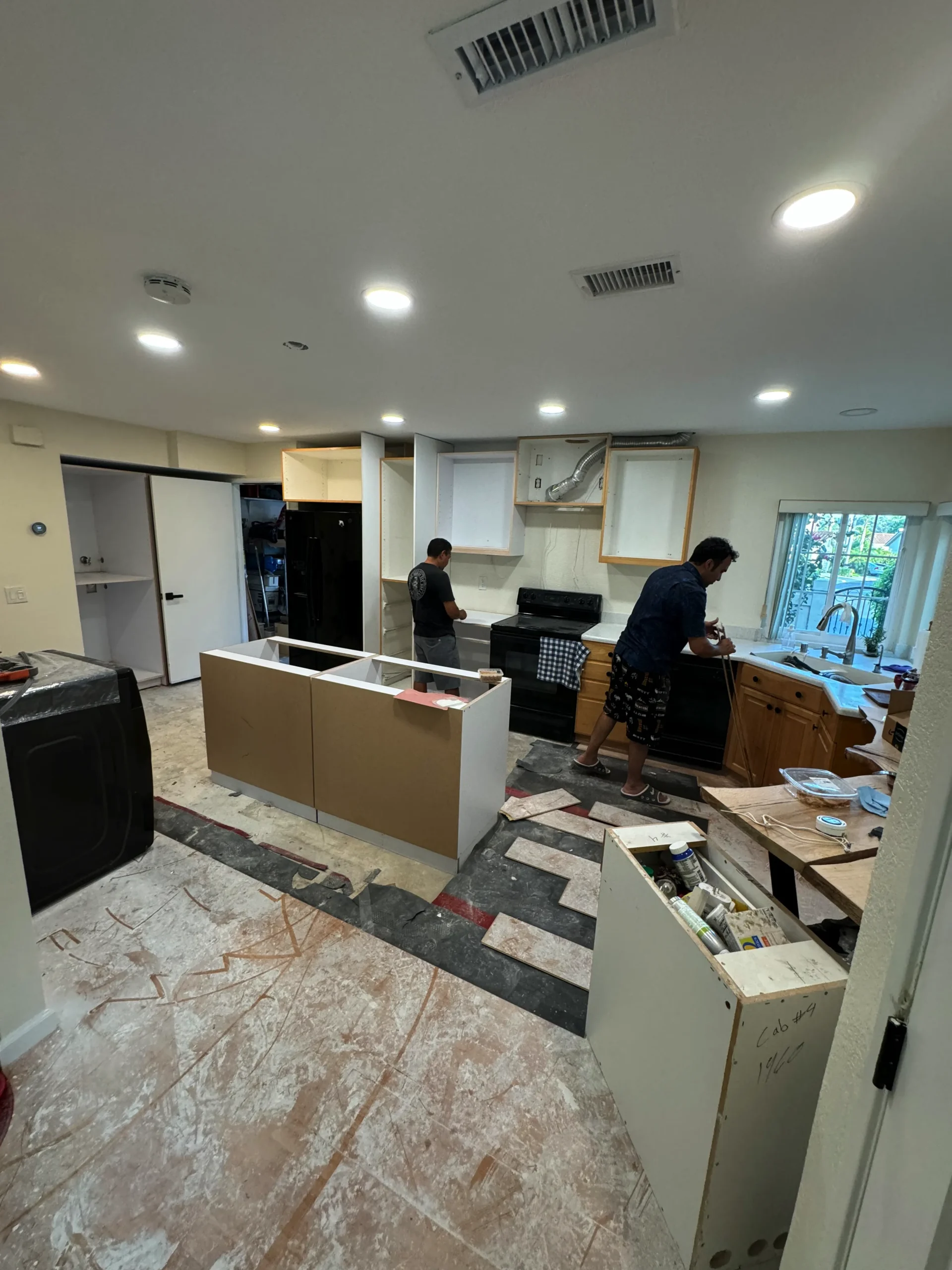 custom kitchen island with white European cabinets La Jolla