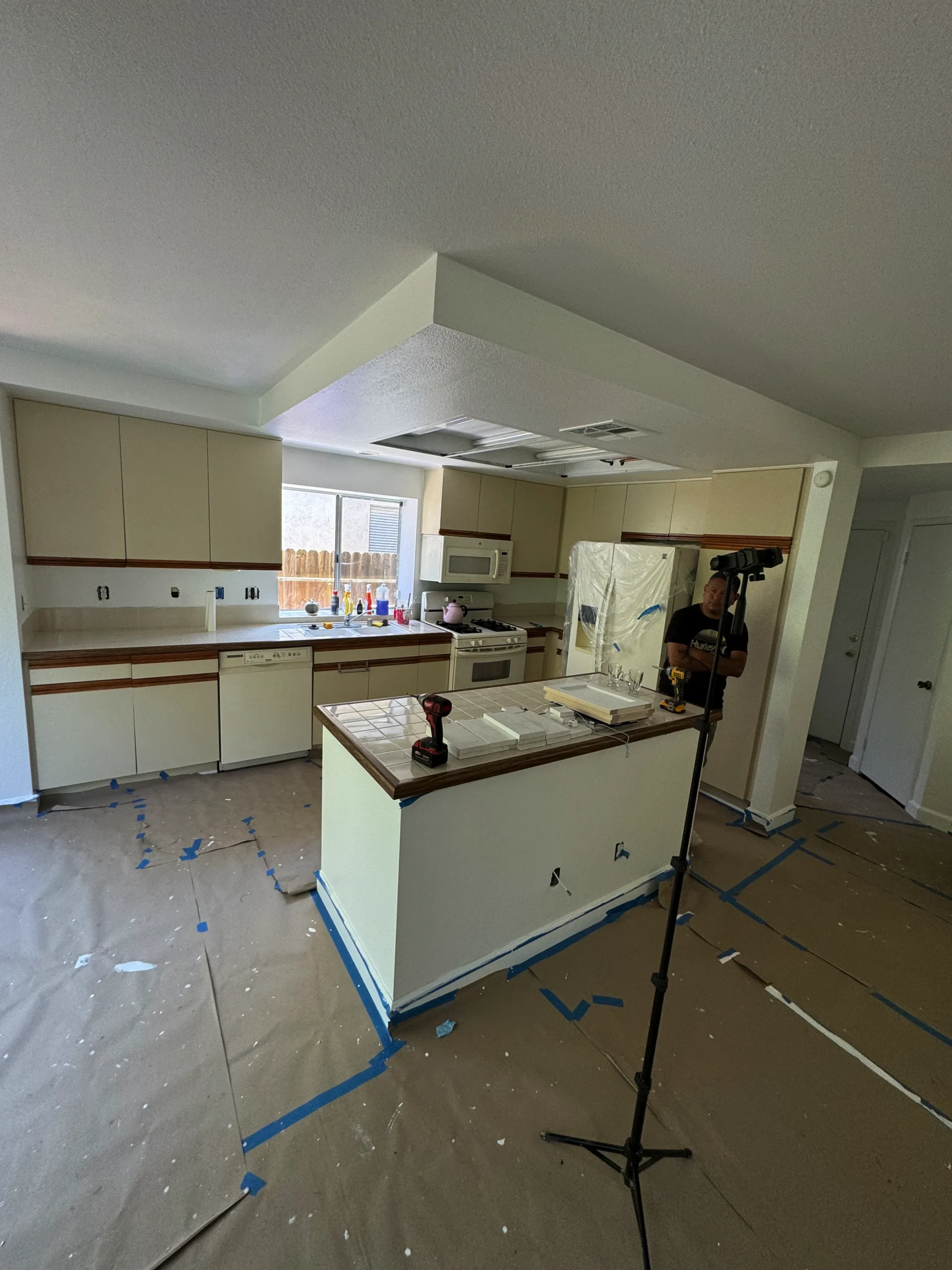 before and after photos of a white shaker cabinet update