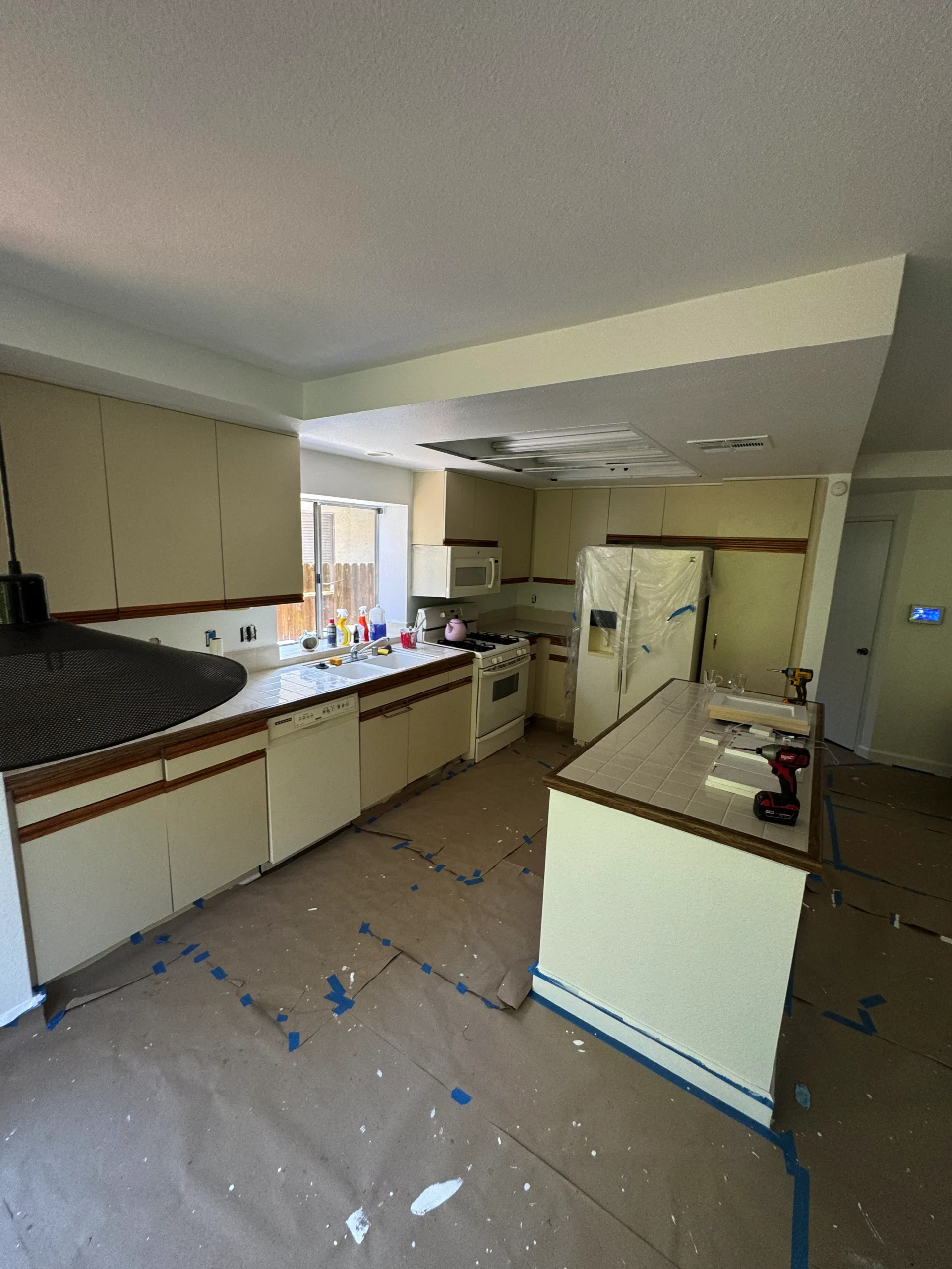refacing dated 80s style cabinets to a modern white shaker look