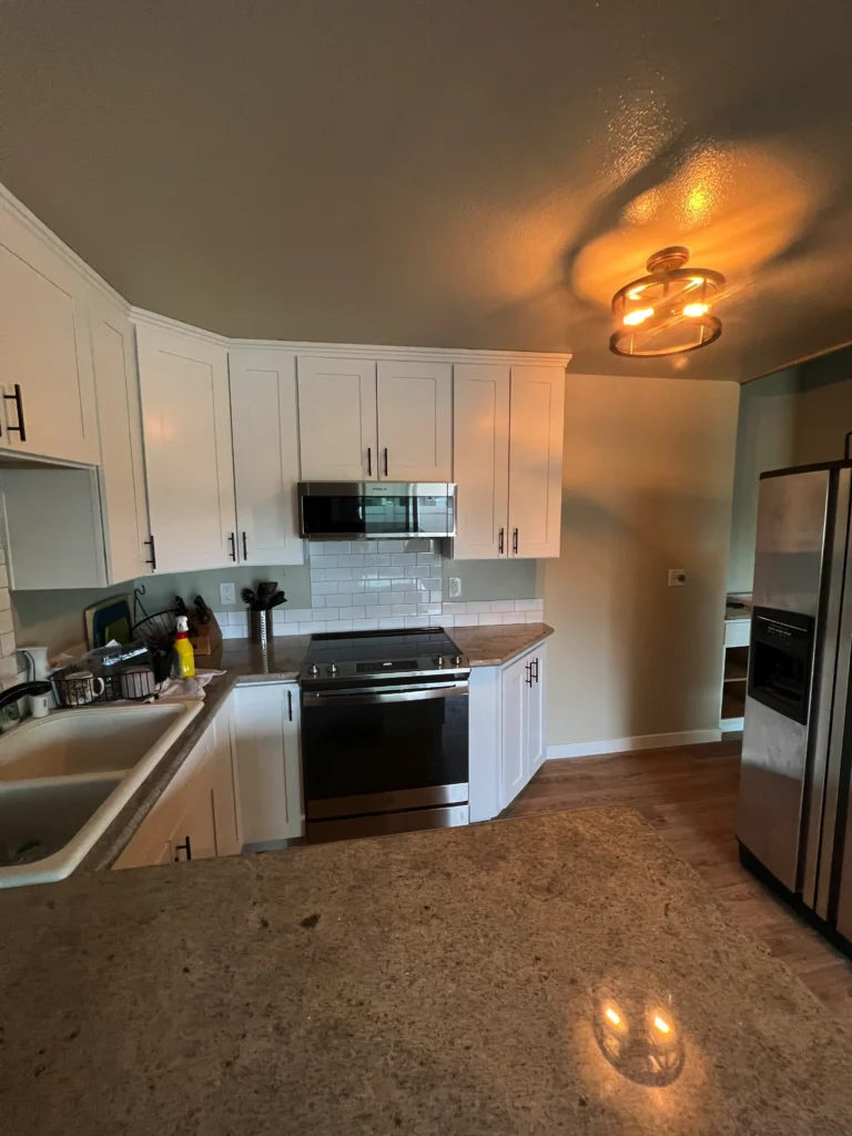 Joe's coastal kitchen with shaker cabinets and granite countertops