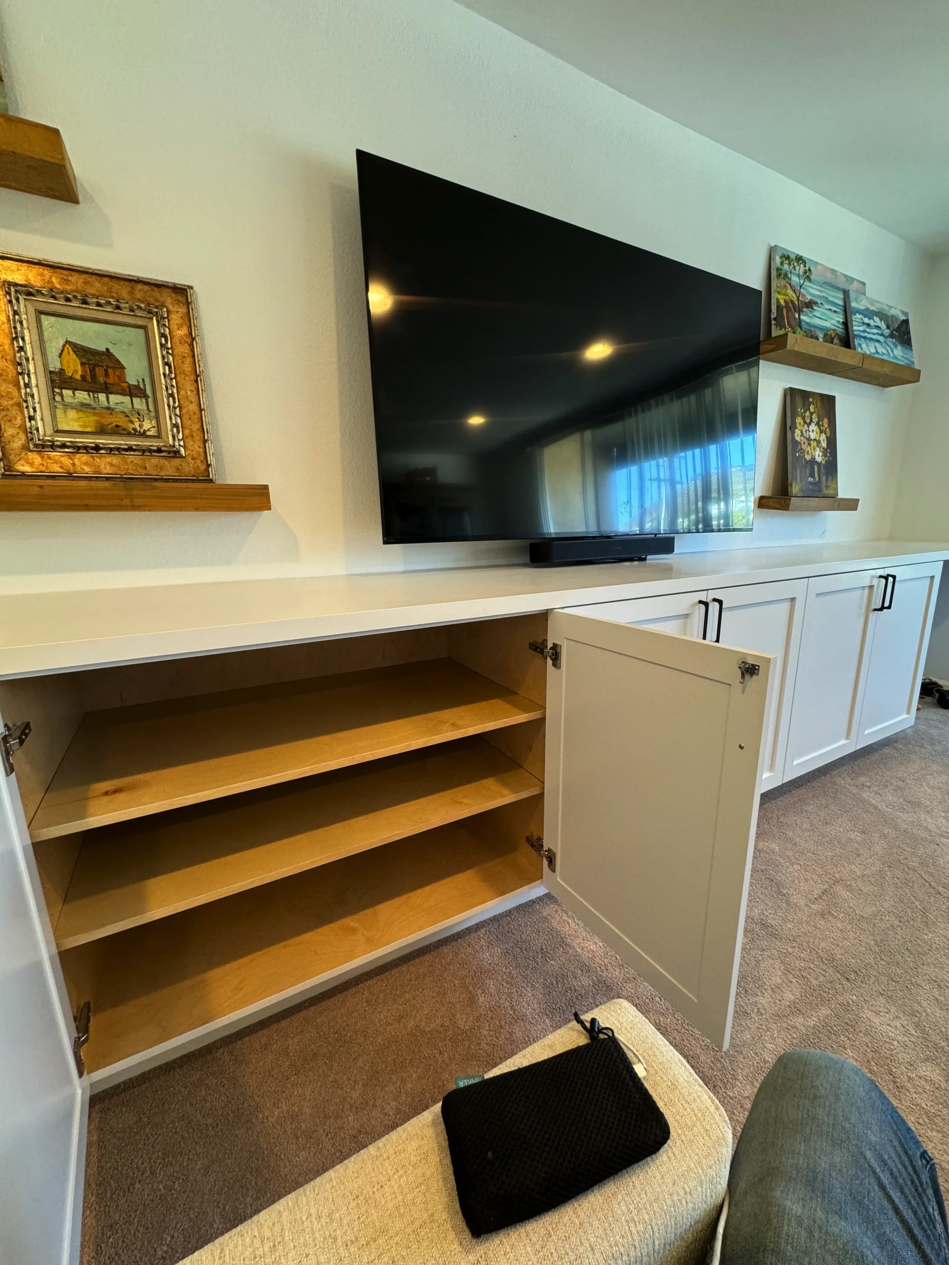 white shaker style media console with matte black hardware