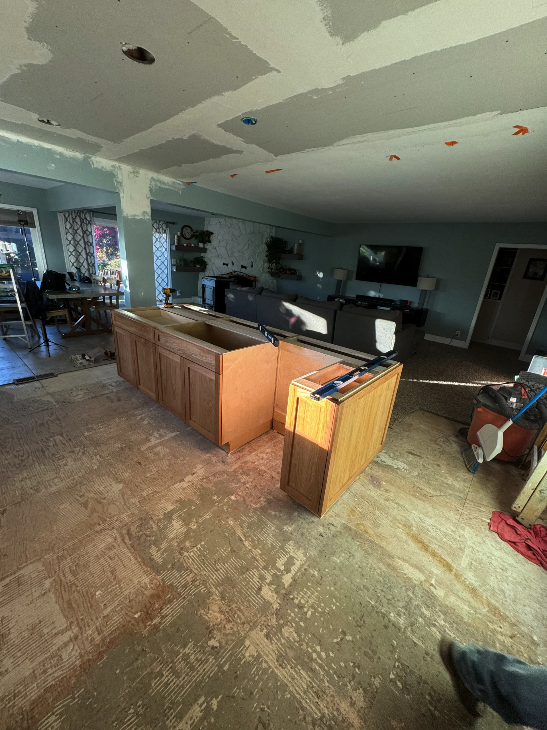 natural wood kitchen island with white quartz countertop in Escondido