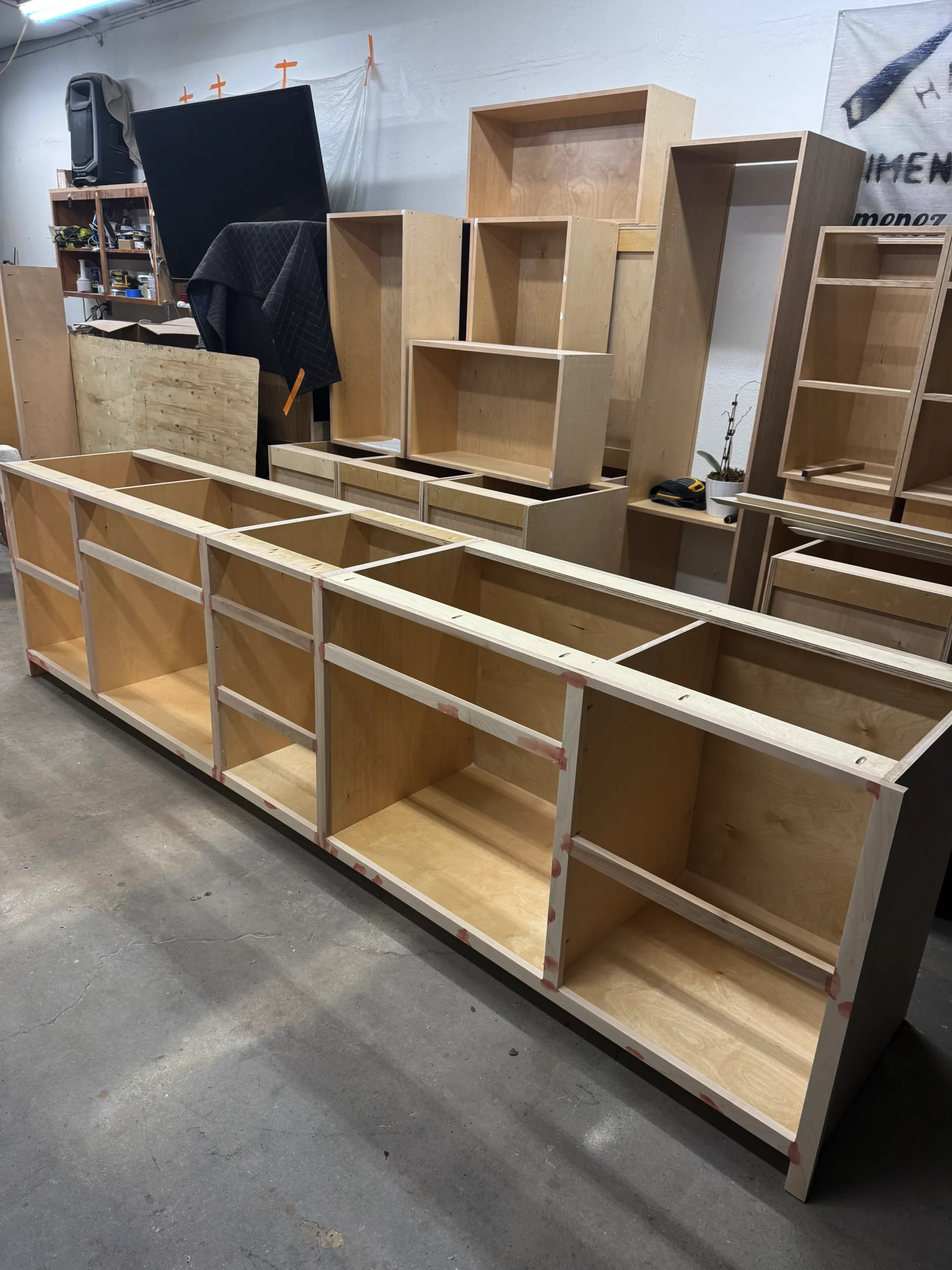 white shaker office cabinets with stained white oak shelves