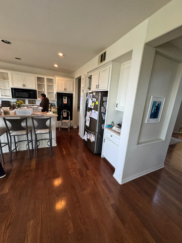 refacing traditional cream cabinets to a modern white kitchen