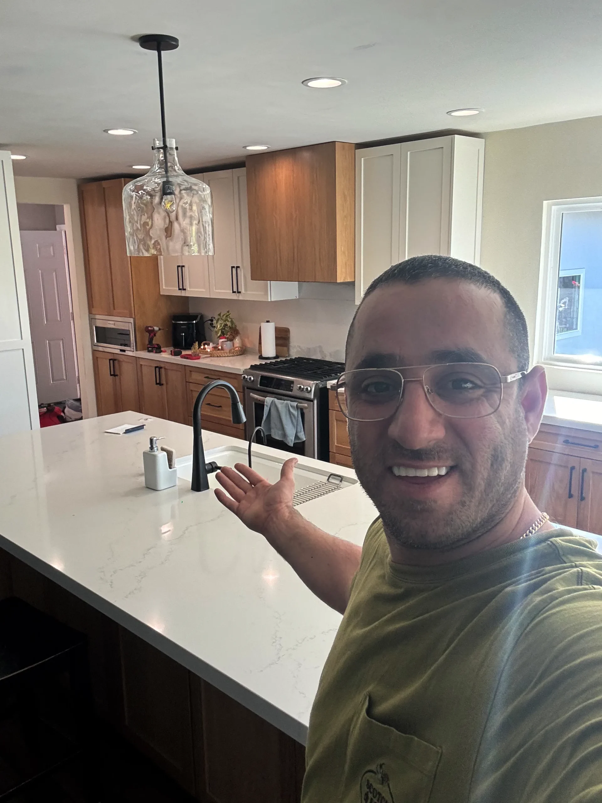 natural wood kitchen island with white quartz countertop in Escondido