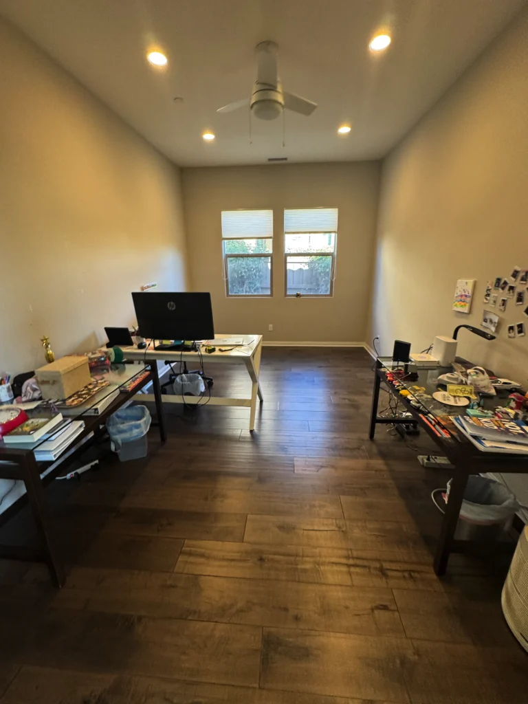 custom home office desk and storage built around a large window