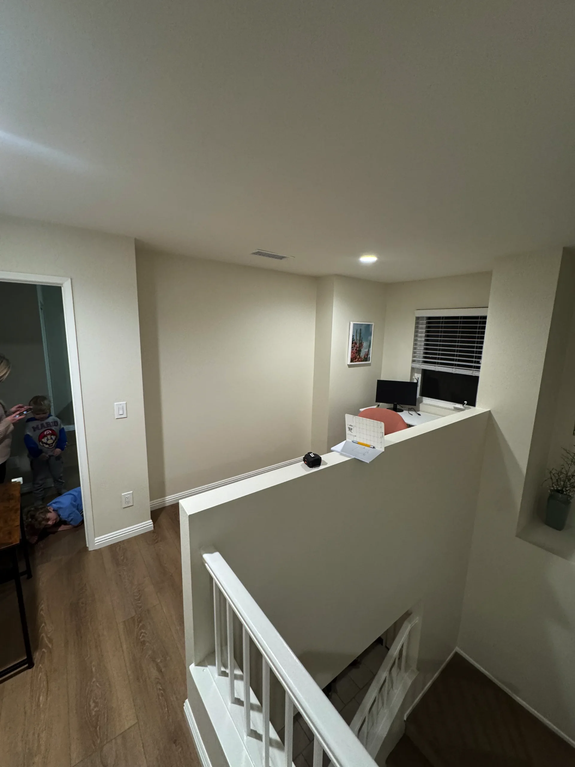 floor-to-ceiling white built-in bookcase with elegant arches