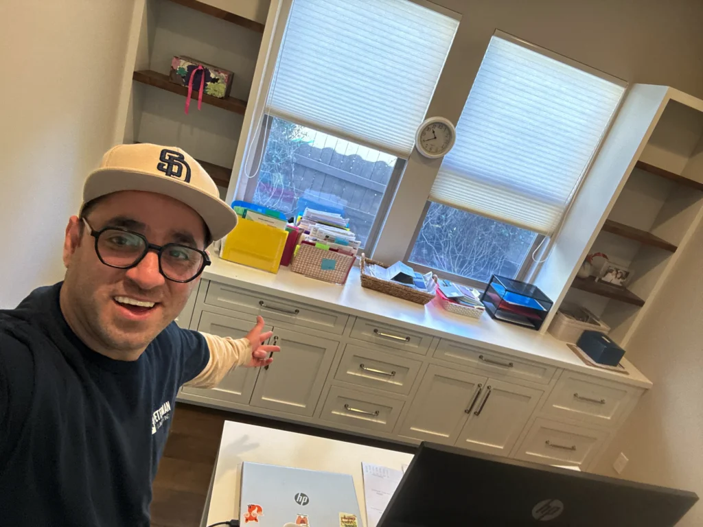 custom home office desk and storage built around a large window