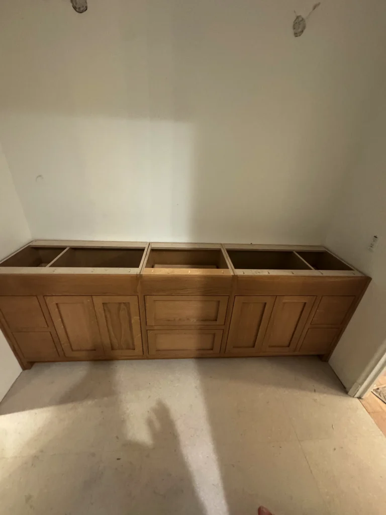 master bathroom remodel with a stained wood double vanity