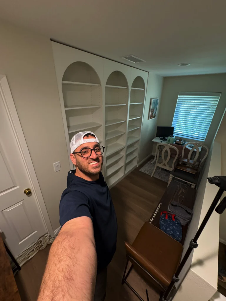 home office and study loft with a custom library shelving unit