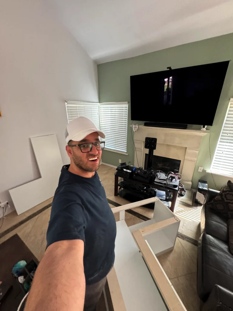 white shaker style built-in storage bench in a living room
