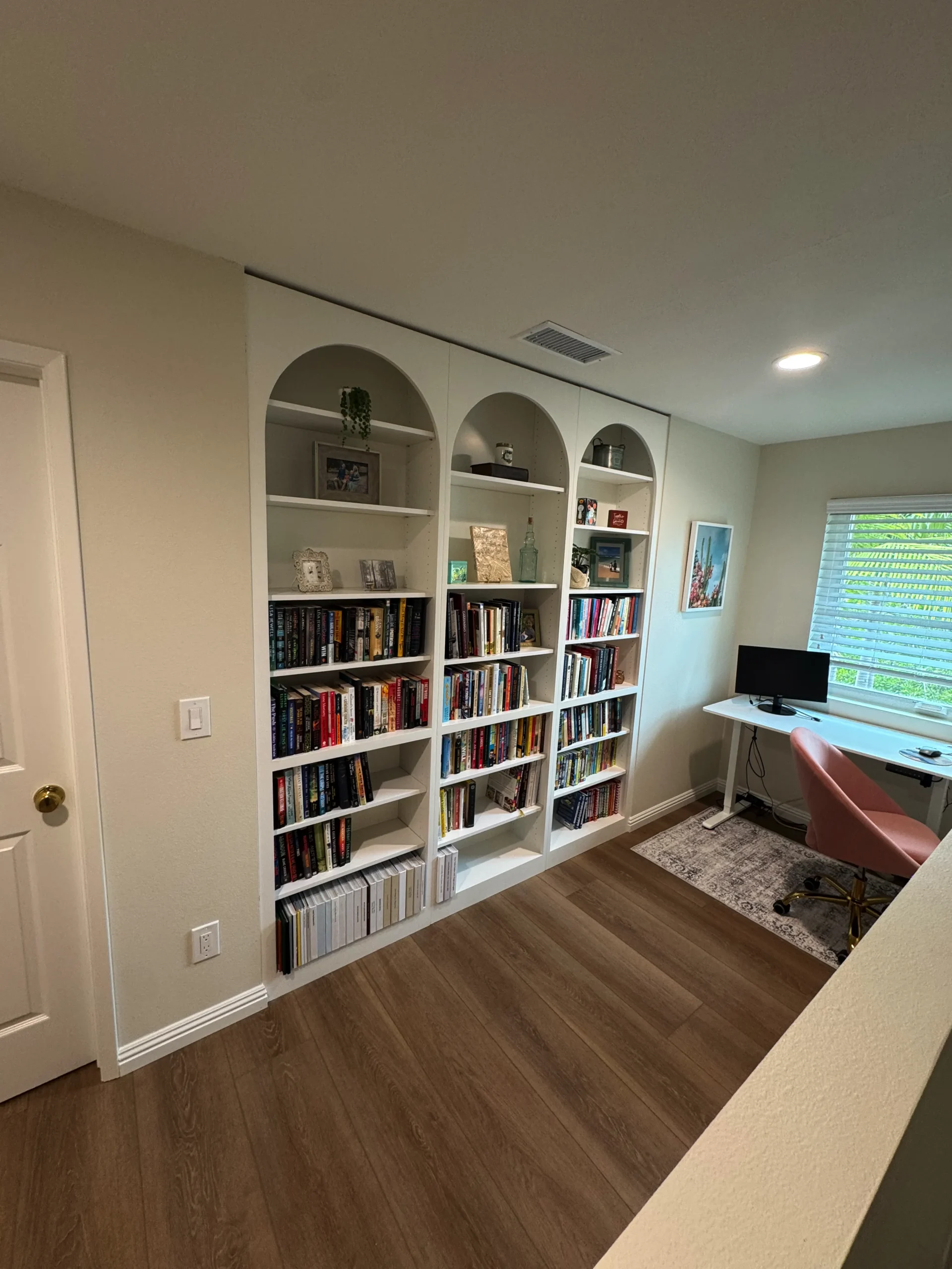 custom arched library bookshelf built-in in Carmel Valley