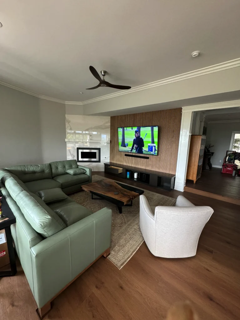 modern white oak slat wall with a floating media console