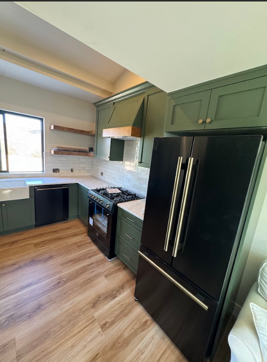 Custom green kitchen cabinets