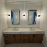 Custom wood double vanity with marble top